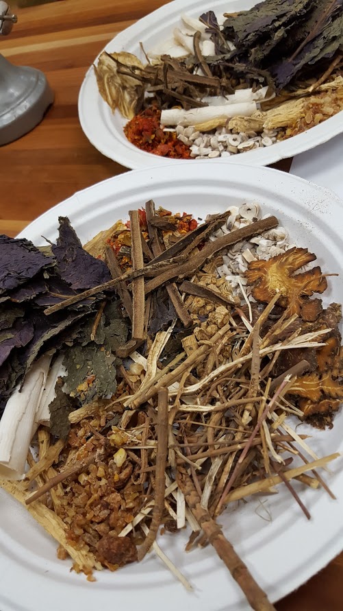 Acupuncturist Lynn Cheng prepared a plate of raw Chinse herbs used for Chinese herbal medicine.